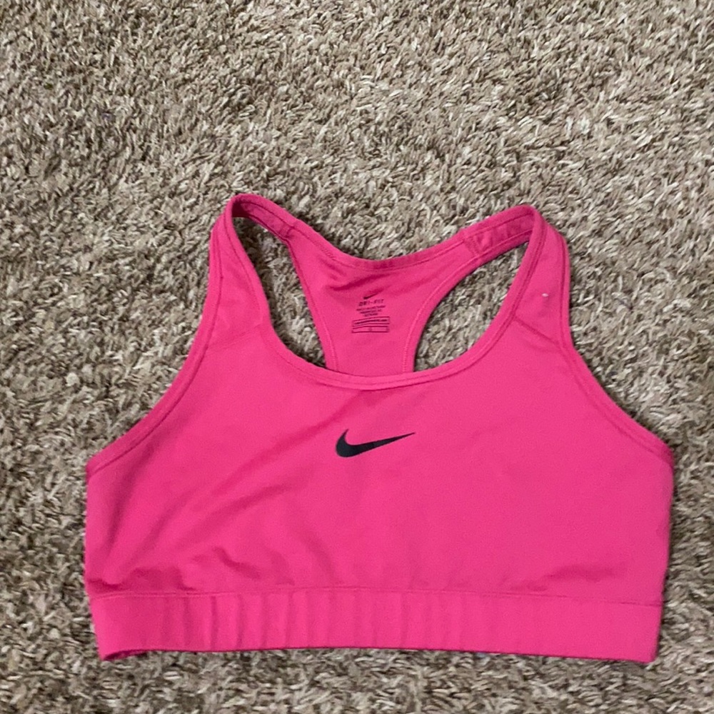 Black zip up bra and pink sports bra